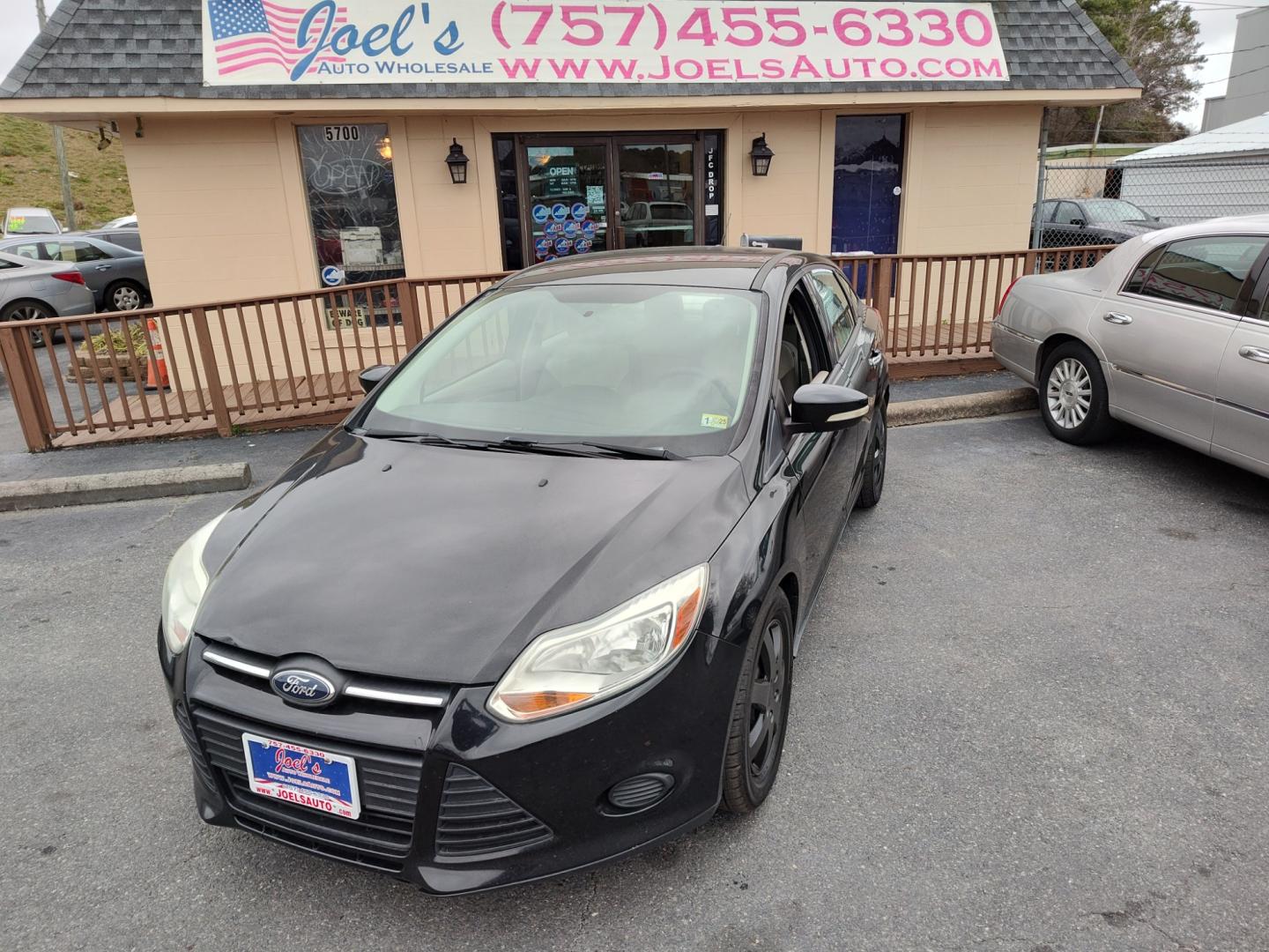 2014 Black Ford Focus (1FADP3F27EL) , Automatic transmission, located at 5700 Curlew Drive, Norfolk, VA, 23502, (757) 455-6330, 36.841885, -76.209412 - Photo#0